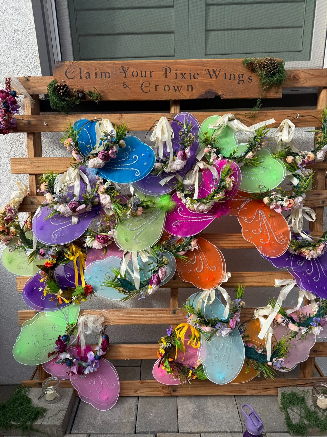Colorful fairy wings and crowns displayed for children