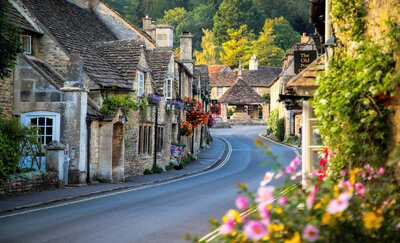 Amy's family walking through a stone village in the Cotswolds
